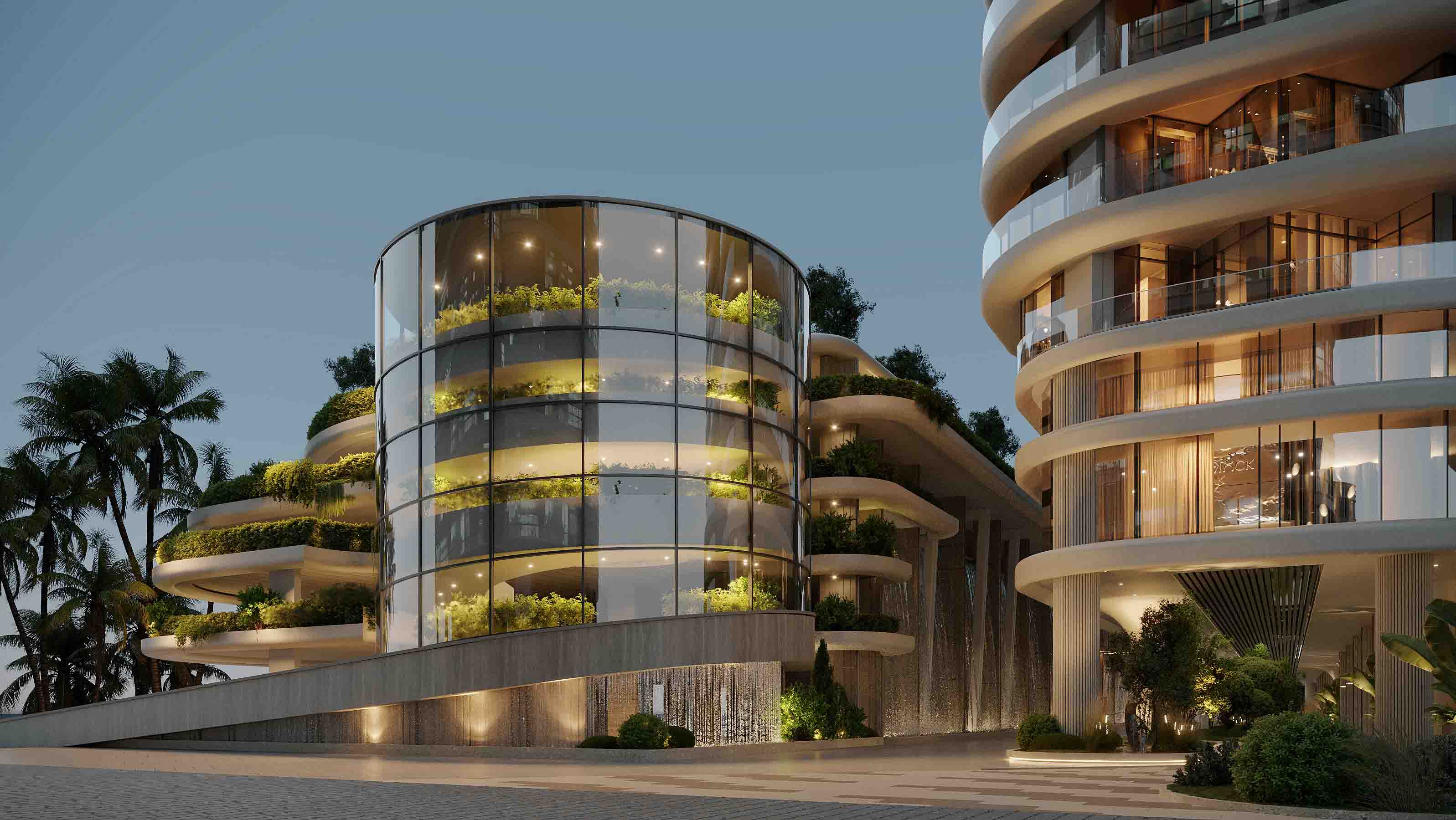 Iconic circular glass pavilion wrapped in planted terraces and evening feature lighting.