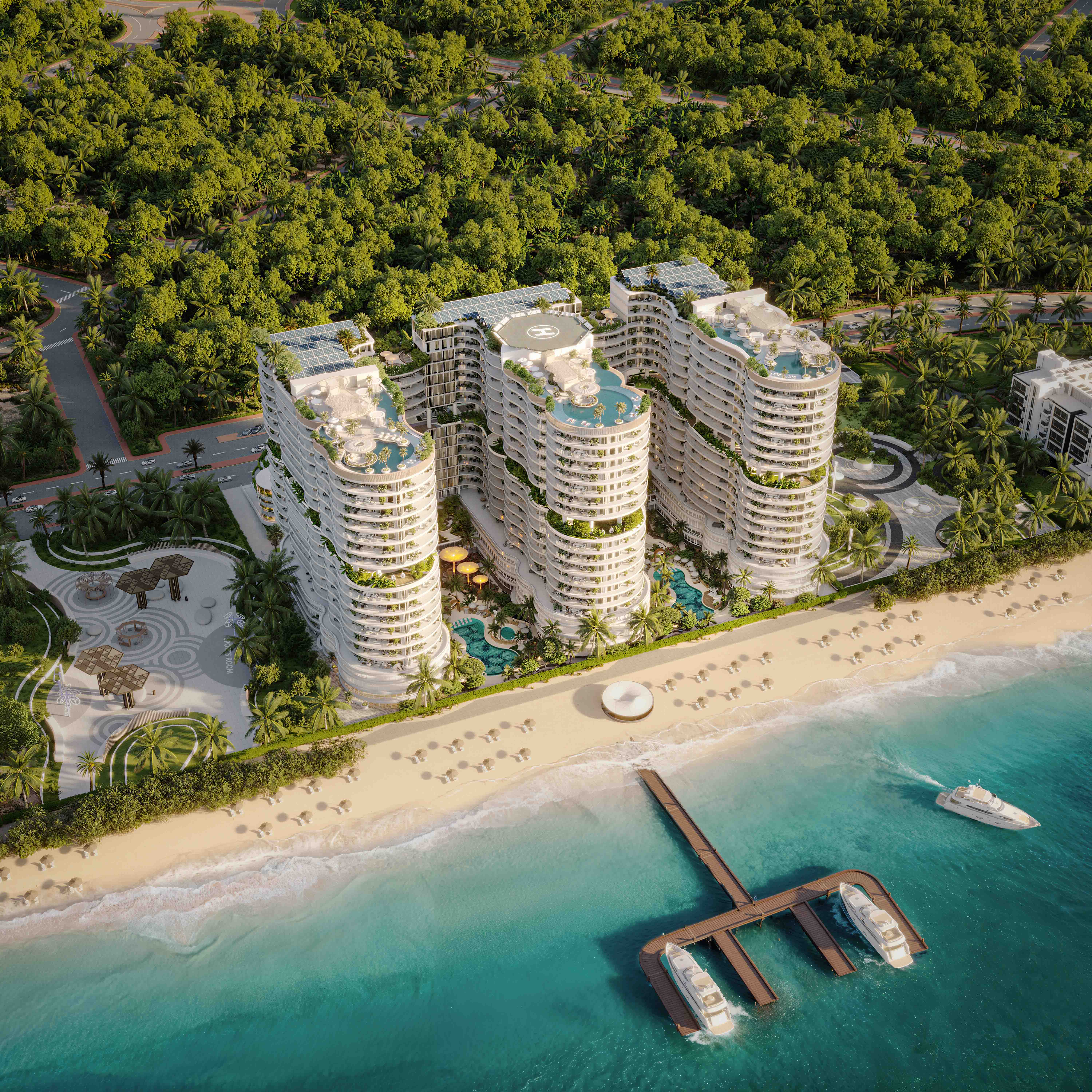 Aerial beachfront view of AMRA’s three lagoonfront towers with private marina and mangroves.