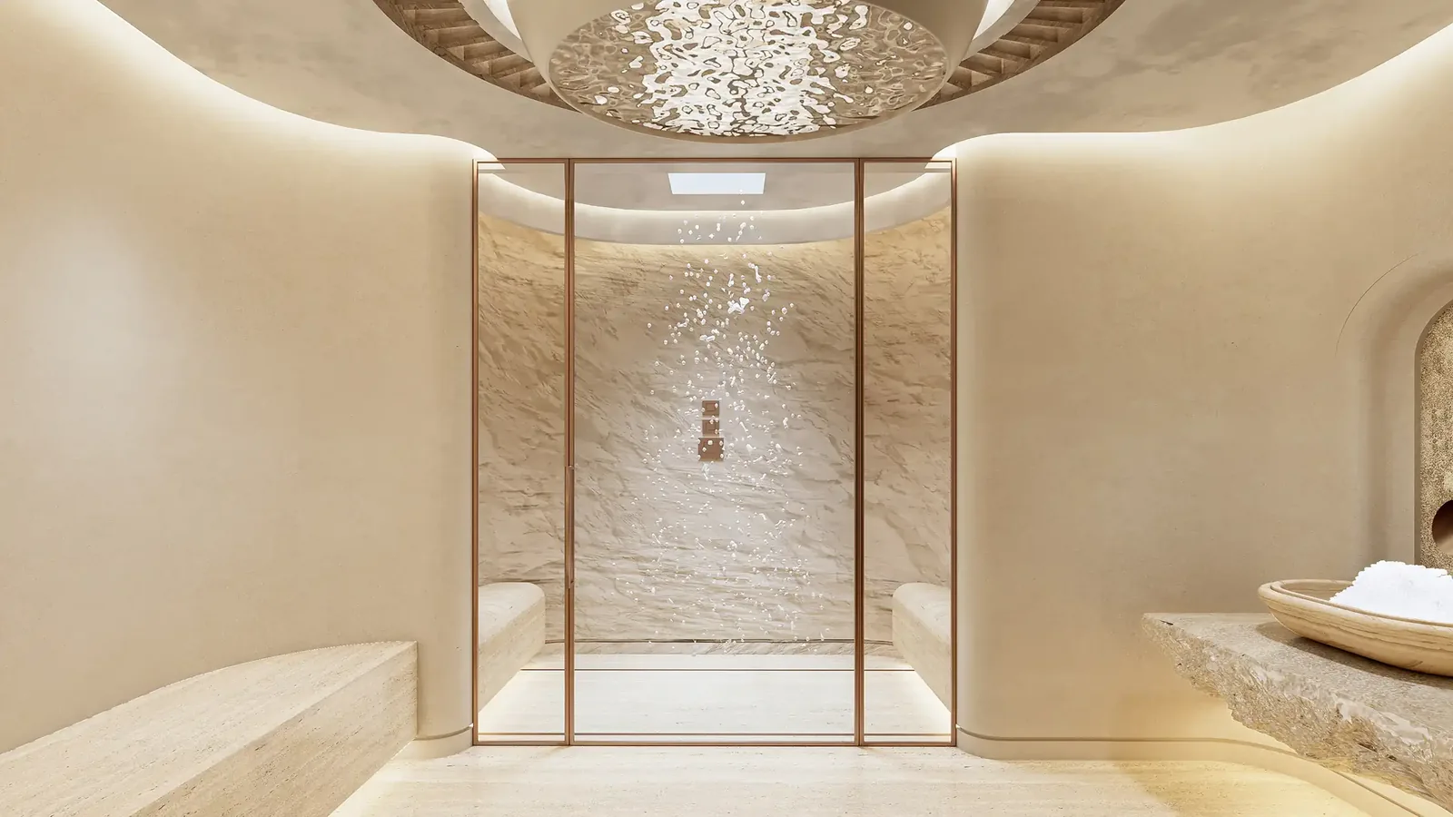 A minimalist treatment suite with natural stone, soft illumination, and a calming ambiance.