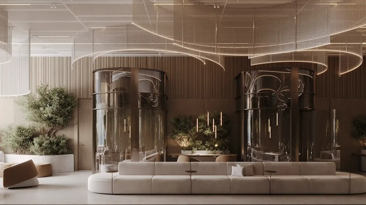 A serene workspace featuring curved glass meeting rooms, soft seating, and indoor greenery.