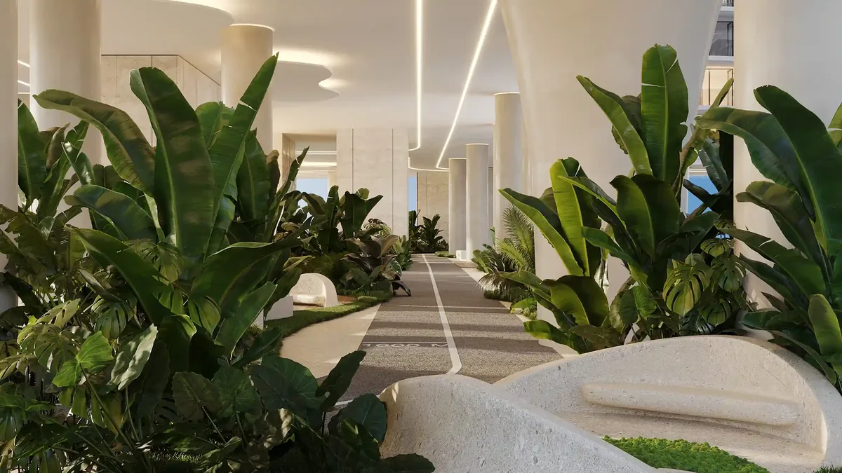 A shaded wellness pathway immersed in tropical greenery, offering a calm and refreshing outdoor retreat.